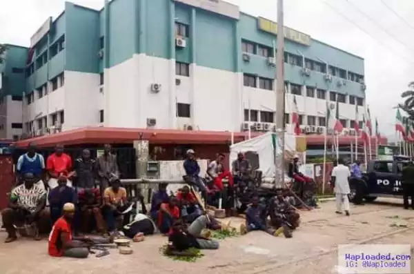 Photos: Thugs stand guard at the gate of PDP Headquaters in Abuja